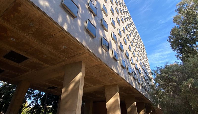 A shot of Bunche Hall with the sky on the upper right