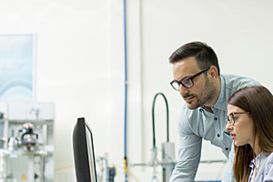Two staff working in the lab