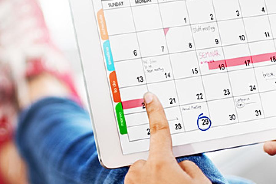 Finger pointing at a calendar
