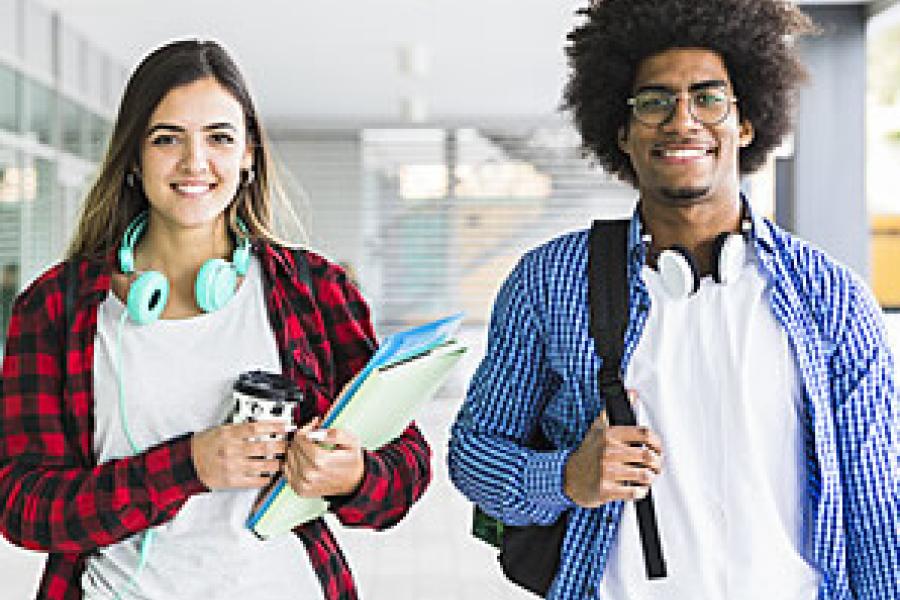 Two students walking on campus
